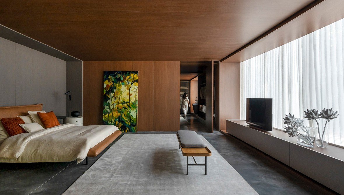 Quarto 'Poesia' com móveis planejados que criam uma conexão afetiva e duradoura, um pilar da sustentabilidade.