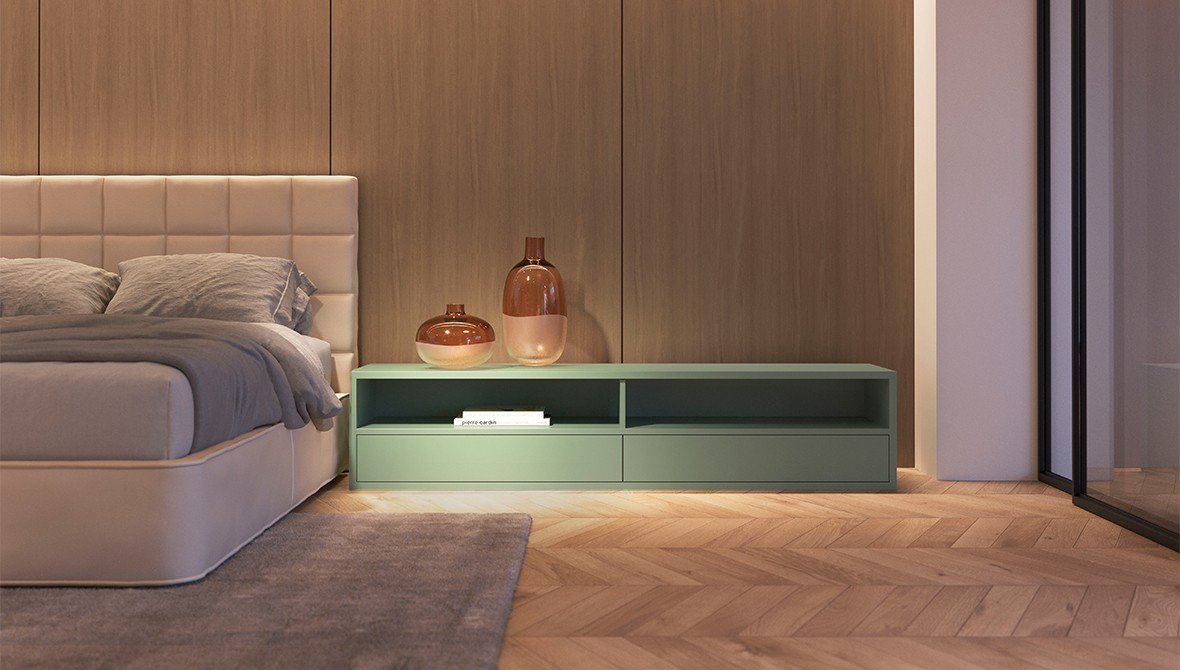 Detalhe de um home office integrado ao dormitório, com bancada e armários Todeschini em tons neutros.